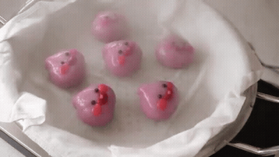 Pink Face Balls Sitting In A Pan GIF