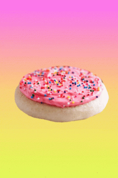 Pink Frosting Cookie With Colorful Sprinkles GIF