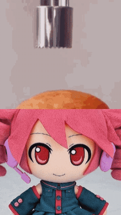 Pink Hair Stuffed Doll Next To Bottle GIF