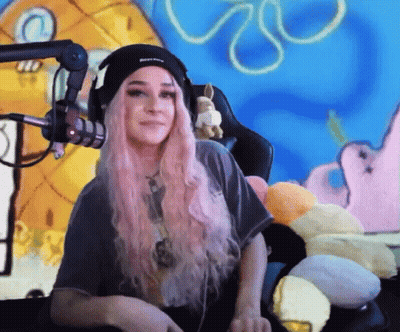 Pink-Haired Girl At Mic With SpongeBob Background GIF