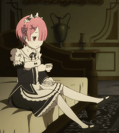 Pink Haired Girl Sitting On Couch Holding Tea GIF