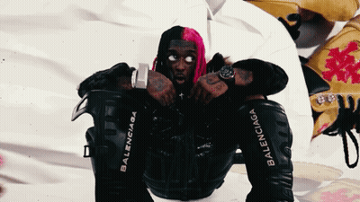 Pink-Haired Man In Black Jacket With Balenciaga Sleeves GIF