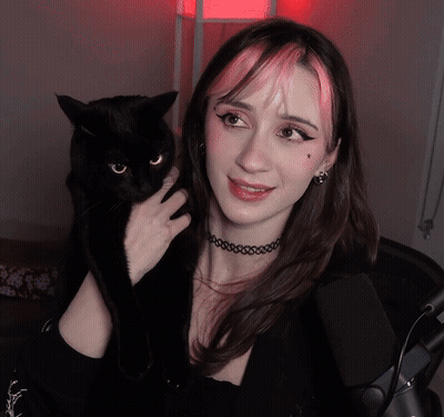 Pink Haired Woman Holding Black Cat GIF