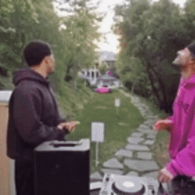 Pink Hoodie Man Next To Black Jacket Man GIF