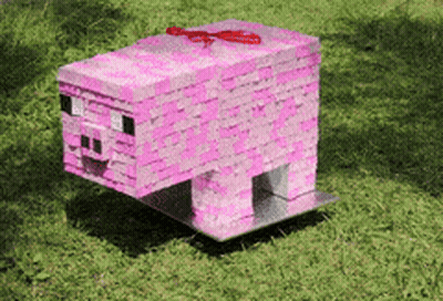 Pink Minecraft Pig With Red Bow In Grass GIF