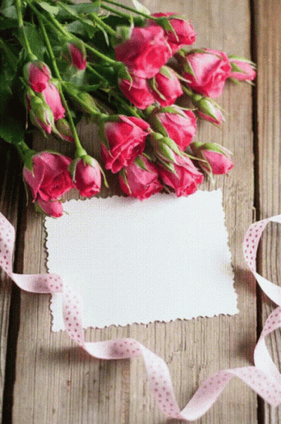 Pink Roses On Wooden Table With Card GIF