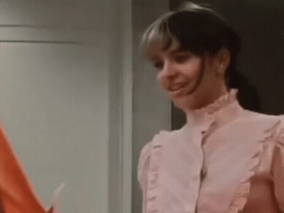 Pink Ruffled Blouse Woman And Red Shirt Man GIF