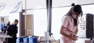 Pink Scrub Top Woman Talking To Masked Man GIF