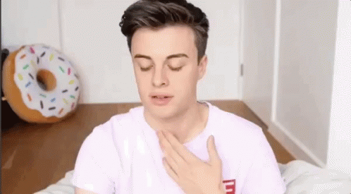 Pink Shirt Man Eyes Closed Hand On Chest GIF