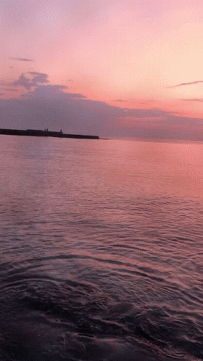 Pink Sky Sunset Over Ocean GIF