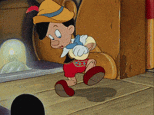 Pinocchio Standing In Front Of Fireplace GIF