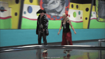 Pirate And Woman In Red Dress Rollerblading GIF