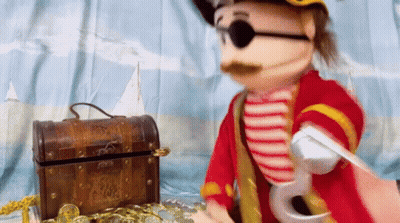 Pirate Puppet Next To Treasure Chest GIF