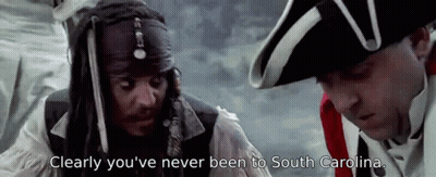 Pirate Standing Next To Man In Military Uniform Talking GIF