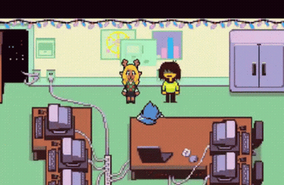 Pixel Art Girl And Boy Standing Next To Computers GIF
