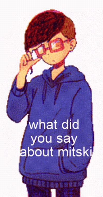 Pixelated Boy In Glasses And Blue Hoodie Saying What Did You Say About Mitski GIF