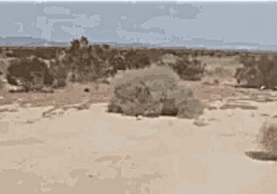 Pixelated Desert Landscape With Mountains GIF