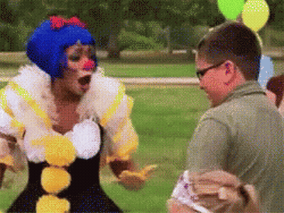 Pixelated Man And Woman Dressed As Clowns GIF