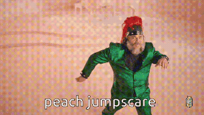 Pixelated Man In Green Suit Dancing Peach Jumpscare GIF