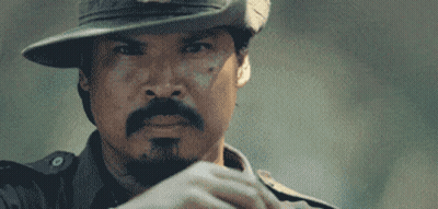Pixelated Man Wearing Hat Holding Paper GIF