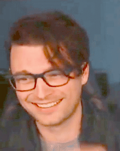 Pixelated Man With Glasses Smiling GIF