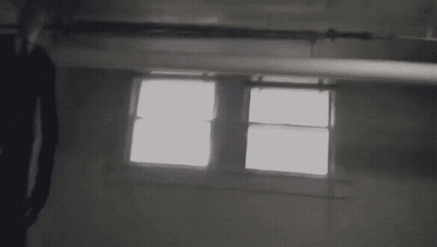 Pixelated Person Standing In Dark Room GIF