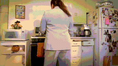 Pixelated Woman In Kitchen With Mun2tv GIF