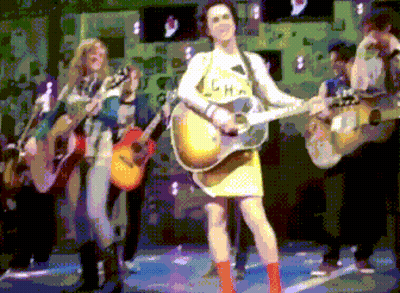 Pixelated Woman Playing Guitar In L.H.A. Shirt GIF