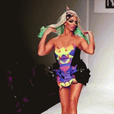 Pixelated Woman Walking Runway With Letter N GIF