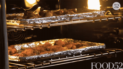 Pizza Cooking On Grill In Circle GIF