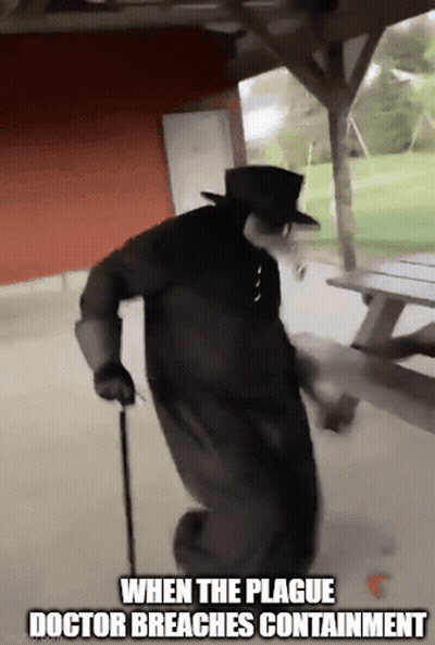 Plague Doctor Walking In Front Of Picnic Table GIF