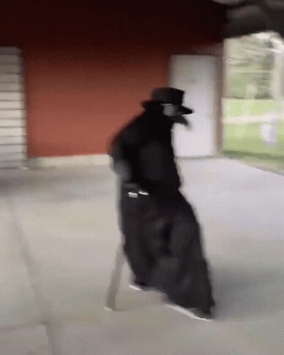 Plague Doctor Walking In Hallway GIF
