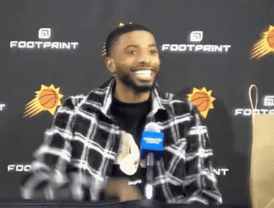 Plaid Shirt Man Smiling At Footprint Banner GIF