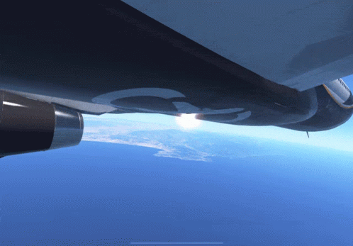 Plane Flying In Sunlit Sky GIF