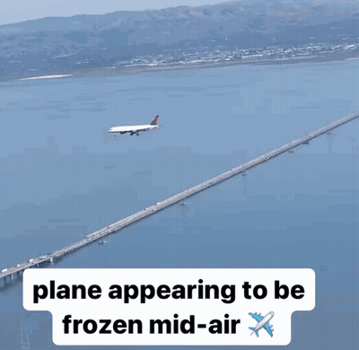 Plane Flying Over Bridge GIF