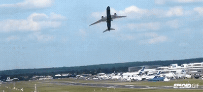 Plane Flying Over Runway With Sploid Gif