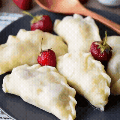 Plate Of Dumplings With Strawberries GIF