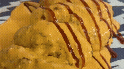 Plate Of Food Covered In Cheese And Sauce GIF