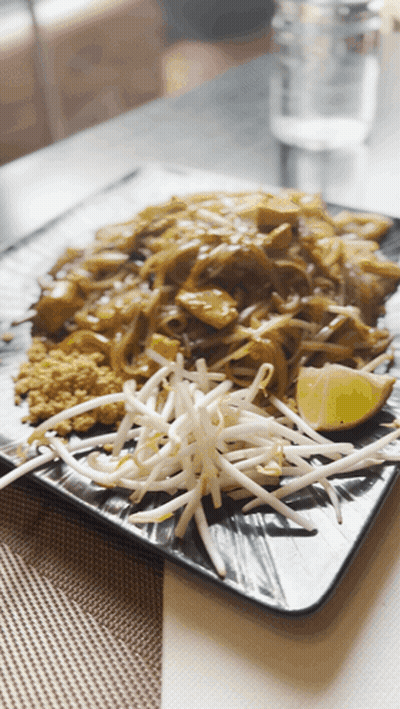 Plate Of Food With Bean Sprouts And Lime Slice GIF
