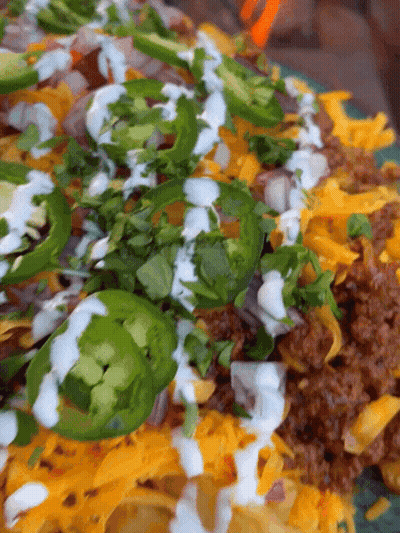Plate Of Food With Jalapenos And Sour Cream GIF