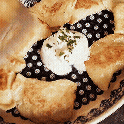 Plate Of Food With Sour Cream And Parsley GIF