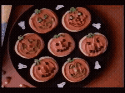 Plate Of Pumpkin And Ghost Cookies GIF