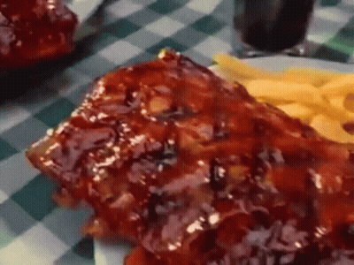 Plate Of Ribs And French Fries On Checkered Tablecloth GIF
