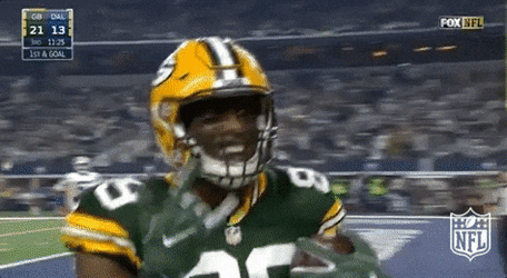 Player Giving Ball To Referee While Doing Hook Em Sign GIF