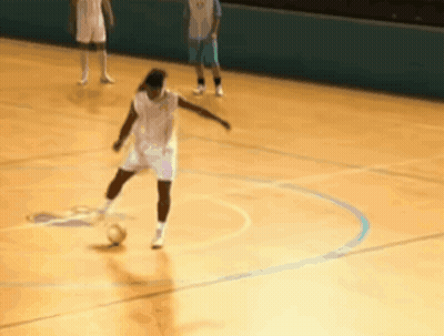 Player Kicks Ball, Another Watches GIF