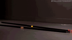 Playful Red Yellow White Dominos Falling GIF