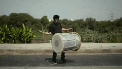 Playing Big Drum GIF