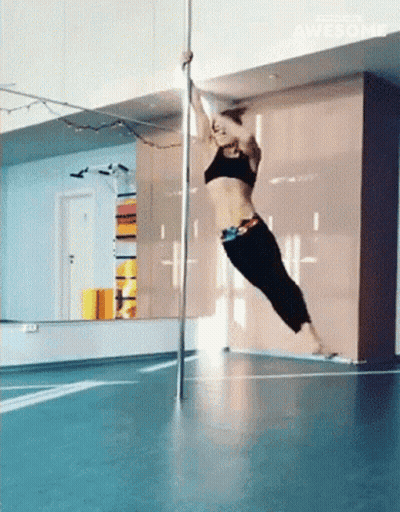 Pole Dancer Doing Trick In Gym GIF