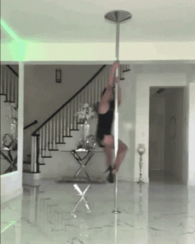 Pole Dancer Doing Trick In Living Room GIF