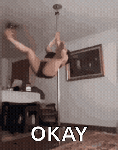 Pole Dancer Doing Trick With Okay Above